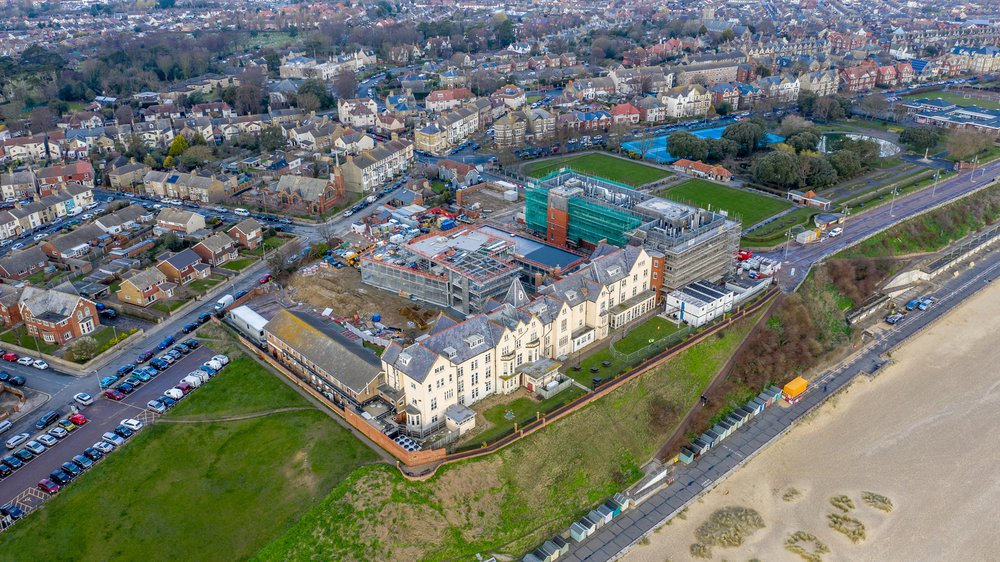 Aerial view of the CEFAS building, which shows it proximity to Lowestoft town centre to the rear of the building and the sea front and beach to the front of the building