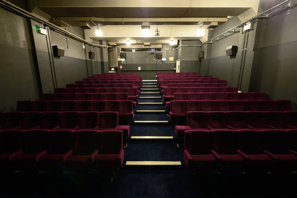 Theatre space with red seating at the Manchester Metropolitan University School of Art