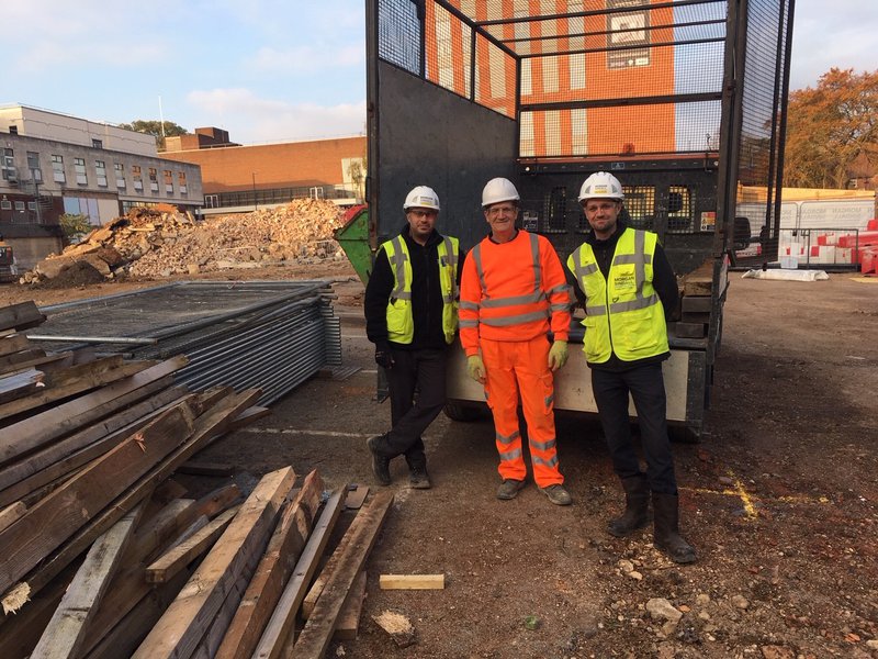 The team at the CCOS St Albans project handing over more timber to be recycled