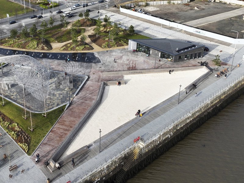 Aerial of the green space, large sandpit and walkways next to Dundee Waterfront