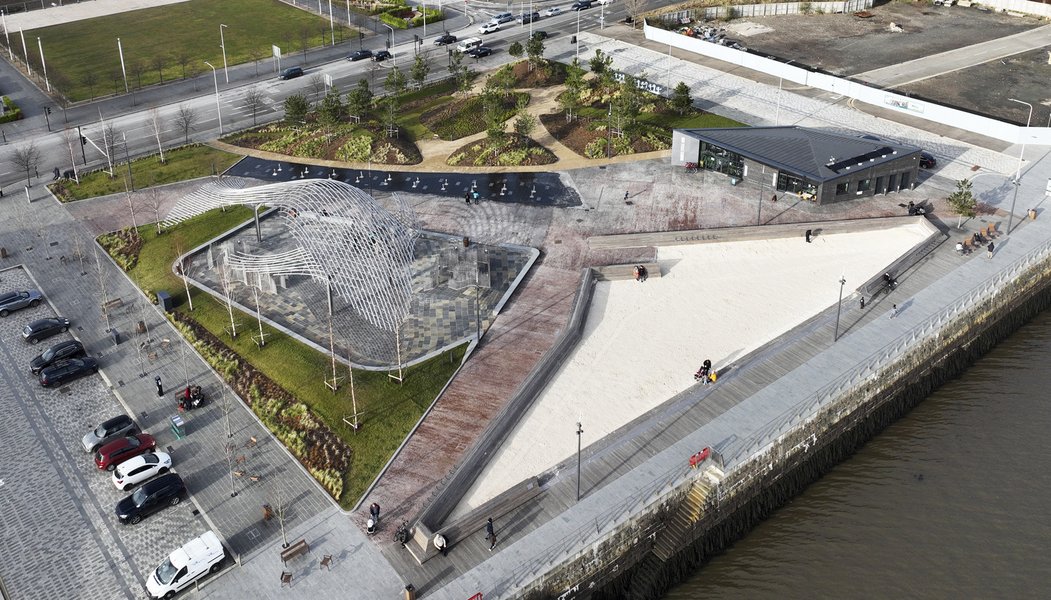 Aerial of the green space, large sandpit and walkways next to Dundee Waterfront