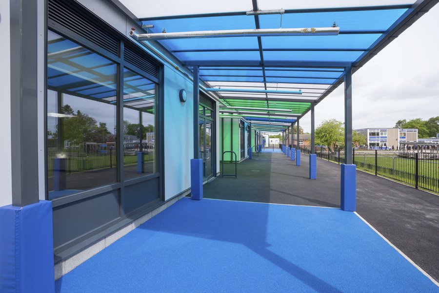 Playground area at Ravensdale School with a blue and green canopy