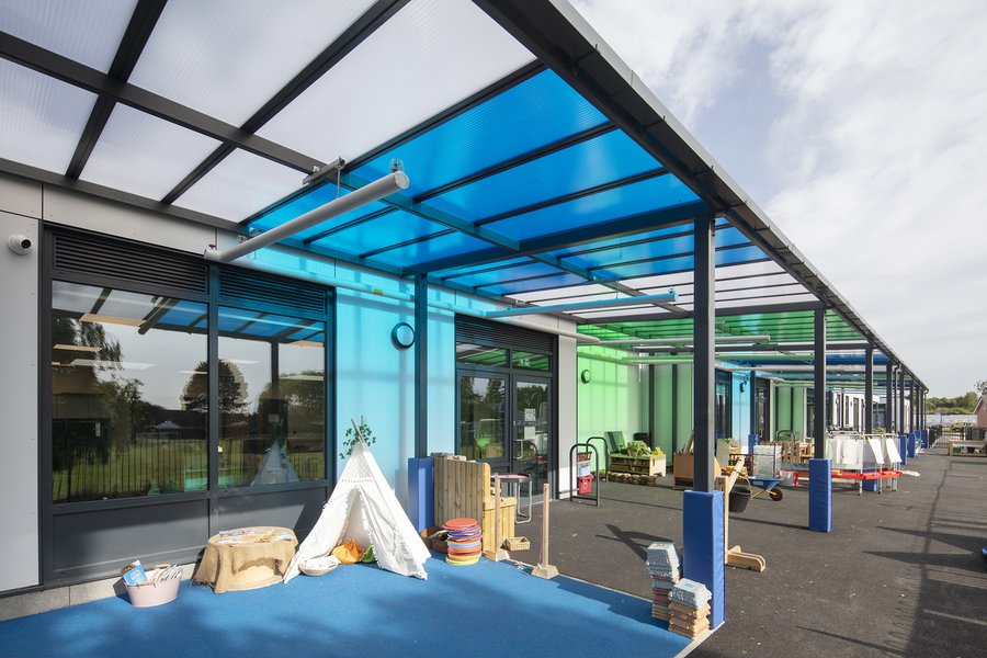 Playground area at Ravensdale School with a blue and green canopy