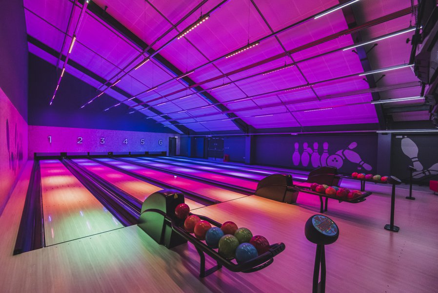 Bowling alley, with pink and purple lighting