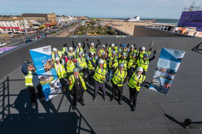 Topping out ceremony attendees on the roof of the Great Yarmouth Marina Centre building