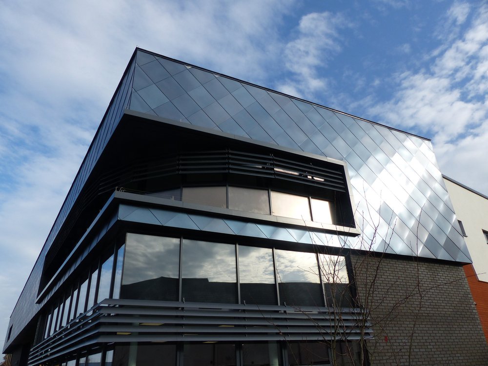 Image of the front of the Ramsgate Fire Station showing the metallic cladding to the top of the building and brickwork to the bottom