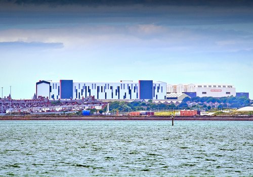Image of the completed Central Yard building, with the image taken from the dockside