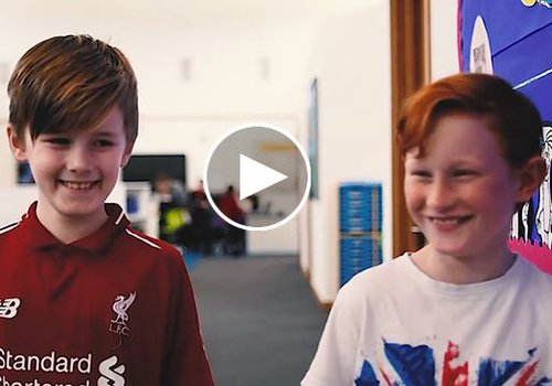 Two male pupils walking through the entrance area of the new Cwmaman School in Wales