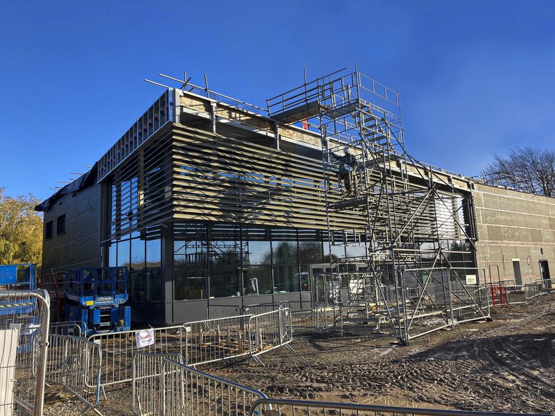 Fulbourn Hospital building showing the cladding being applied to the front of the building