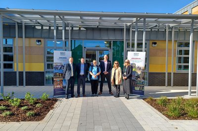 The team at Hillbourne School handover event in front of the school entrance