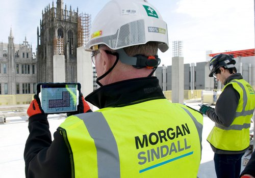Image of two men in PPE (Personal Protective Equipment) on a Morgan Sindall Construction site