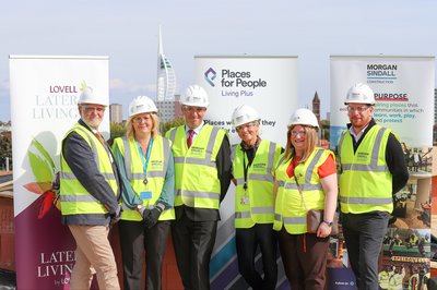 Attendees wearing personal protective clothing at the topping out event