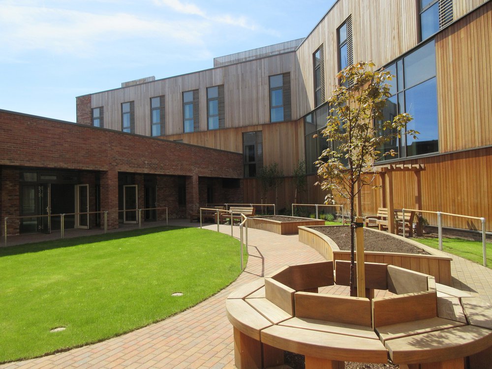 Image of the rear of the Woodside Health Centre in Scotland which shows the garden area