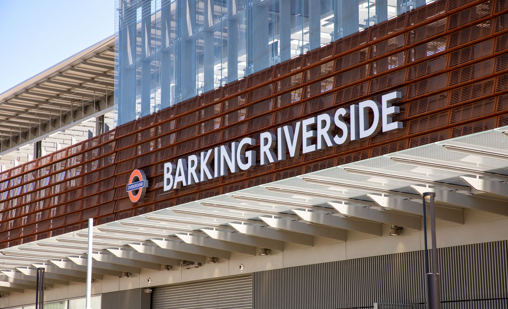 The exterior of Barking Riverside station, with the name and London Transport roundel visible