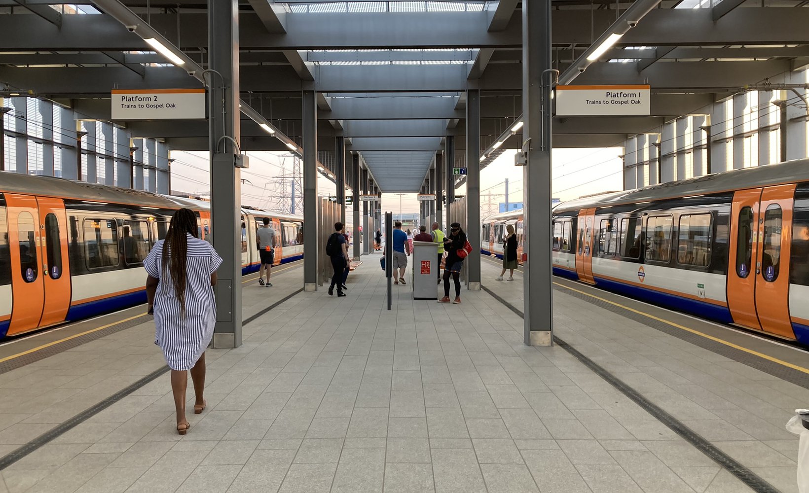 Two platforms at Barking Riverside station, each with a train waiting.