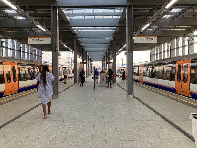 Two platforms at Barking Riverside station, each with a train waiting.