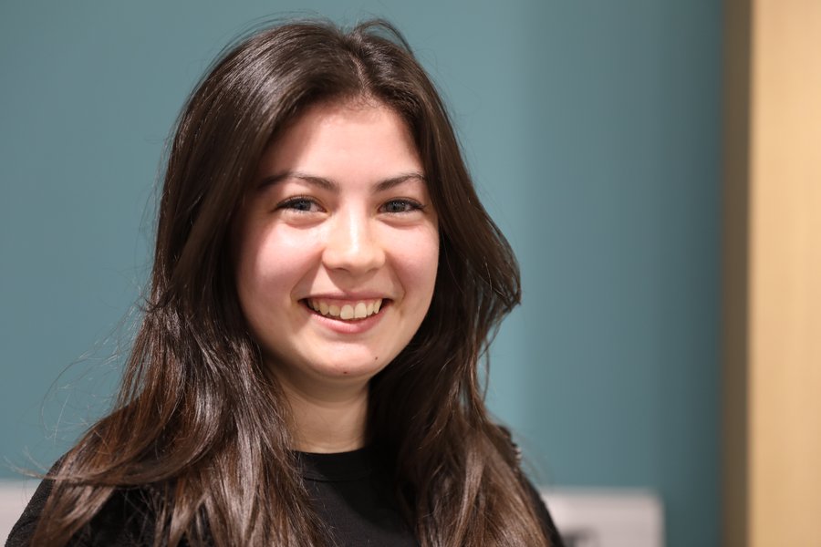 A Morgan Sindall Infrastructure employee sits smiling at the camera