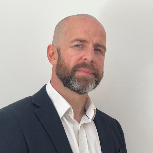 Morgan Sindall Infrastructure colleague Dean Flanagan stands looking at the camera