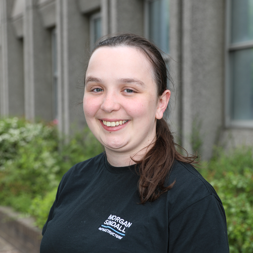 Morgan Sindall Infrastructure colleague Lucy Thomson stands smiling at the camera