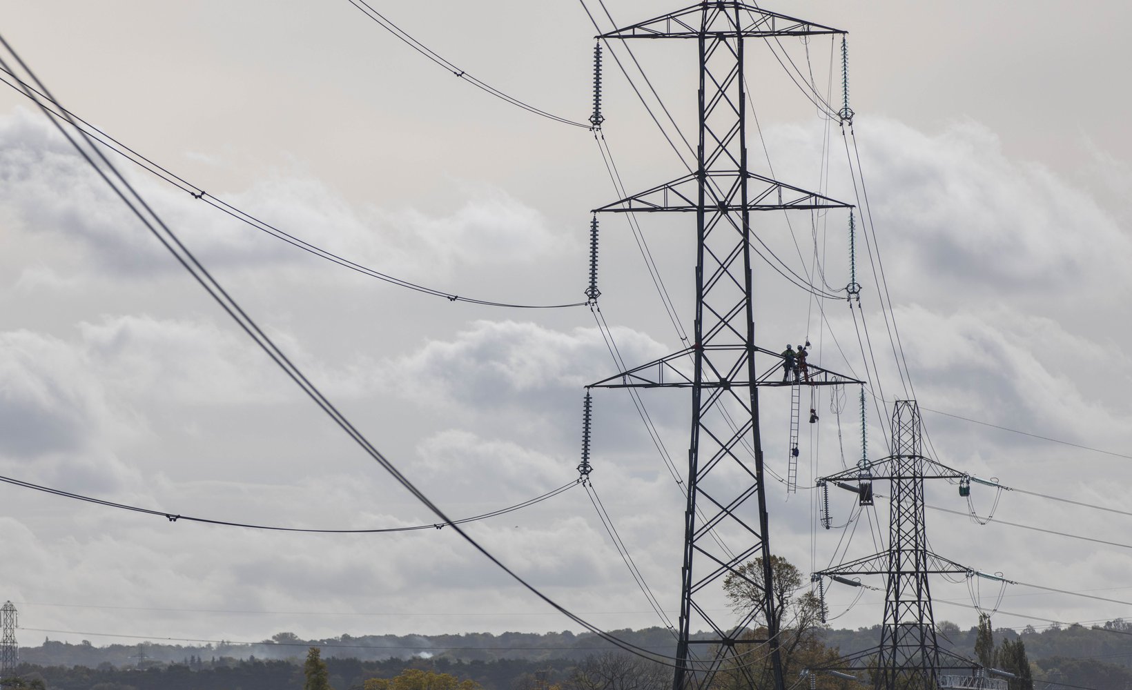 Overhead lines team work on towers as part of the ZA project