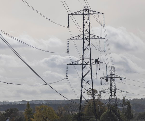 Overhead lines team work on towers as part of the ZA project